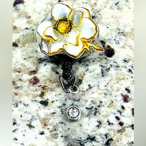 Flower badge reel. Badge pull.